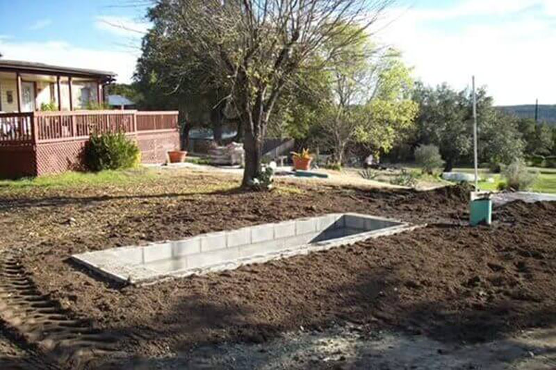 Filling The Bunker With Soil Around It